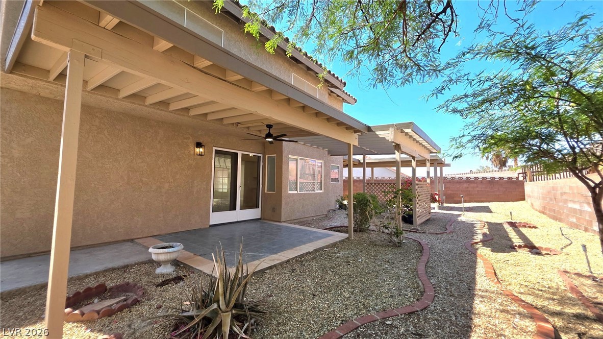 2155 Athol Way Laughlin, NV 89029 - Photo 16 of 19 A private, low-maintenance backyard retreat featuring a covered patio and xeriscaping.