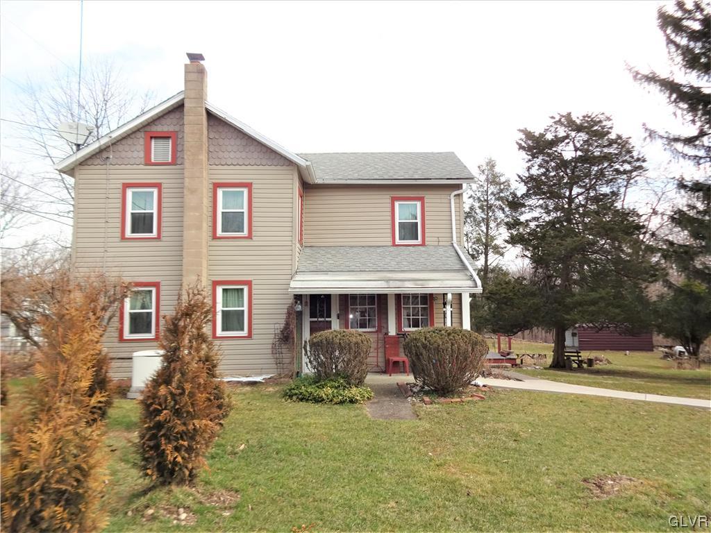 583 Shooktown Road Bangor, PA 18013 - Photo 2 of 44 a front view of a house with garden and trees