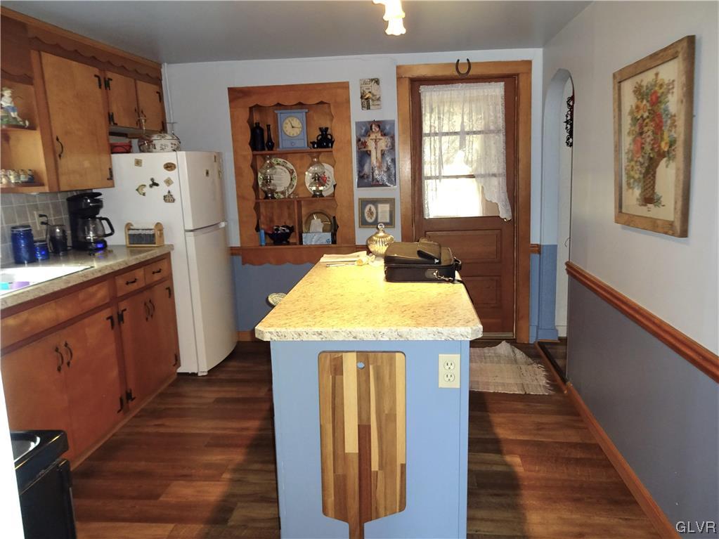 583 Shooktown Road Bangor, PA 18013 - Photo 23 of 44 a kitchen with kitchen island wooden floor center island and stainless steel appliances