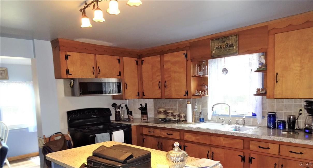 583 Shooktown Road Bangor, PA 18013 - Photo 24 of 44 a kitchen with a sink a stove and a microwave
