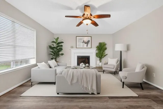 a living room with furniture and a fireplace