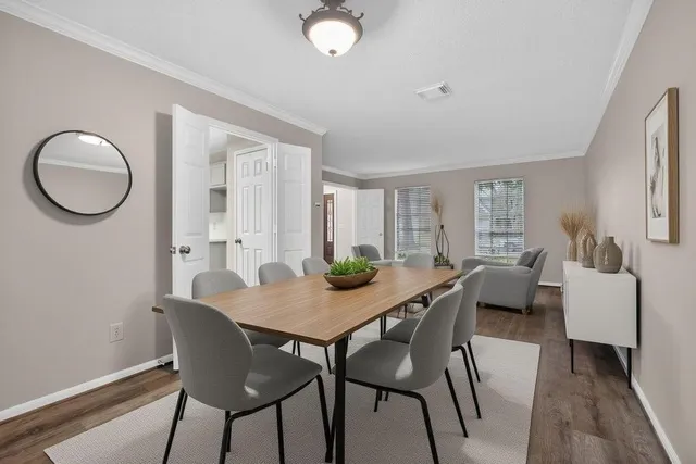 a dining room with furniture and window