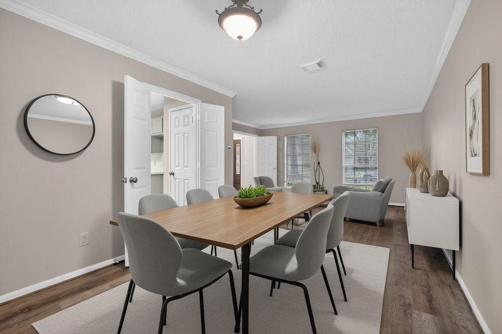 8815 Stoney Bend Drive Spring, TX 77379 - Photo 6 of 50 This photo showcases a modern, inviting dining and living area with neutral tones.