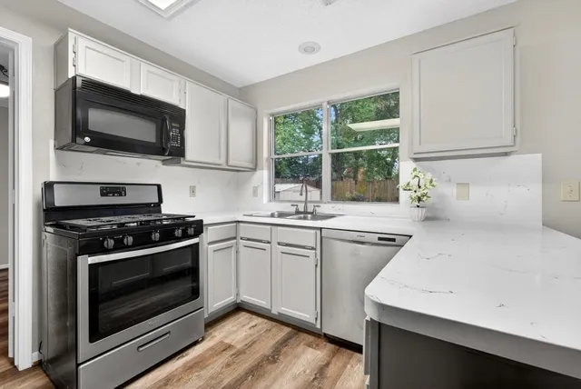 a kitchen with a stove and a microwave