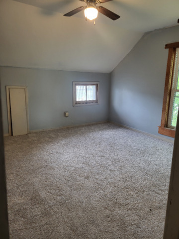 801 Main Street Crescent City, IL 60928 - Photo 11 of 11 an empty room with a empty space and a window