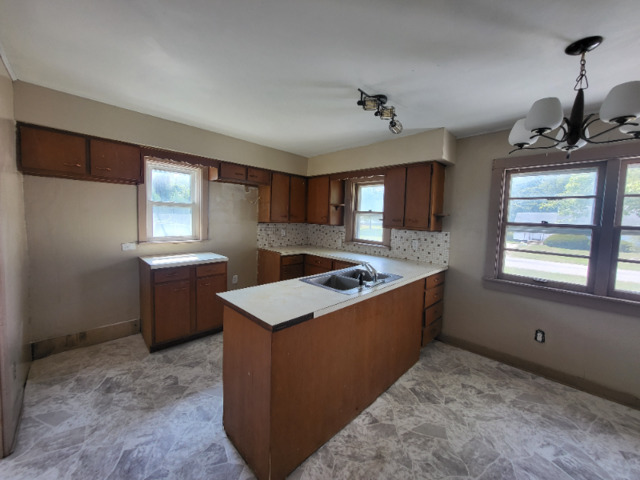 801 Main Street Crescent City, IL 60928 - Photo 3 of 11 a kitchen with stainless steel appliances granite countertop a sink stove and refrigerator