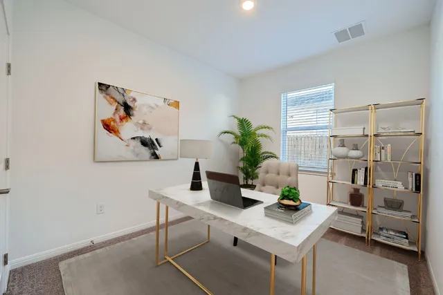 a view of a workspace with furniture