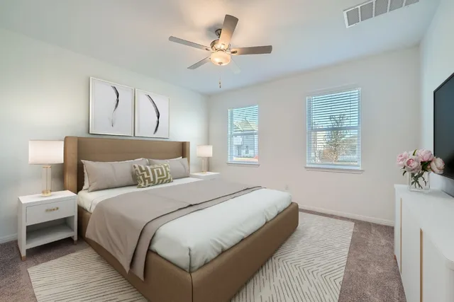 a bedroom with bed and a chandelier