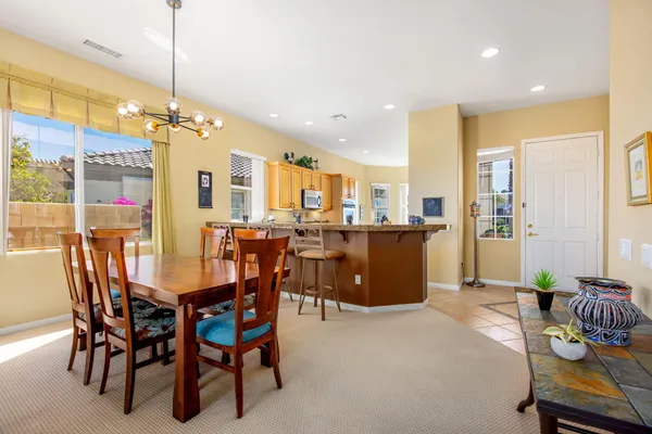 a dining room with furniture and window
