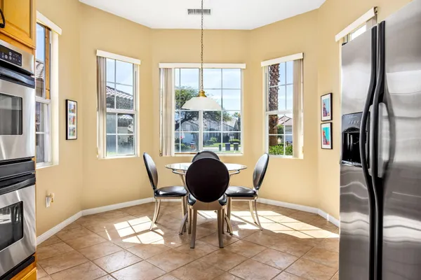 a view of a living room with furniture and windows