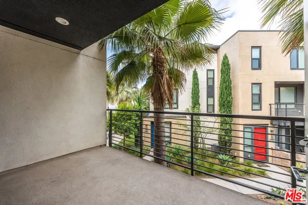 a bathroom with a toilet a sink and a mirror