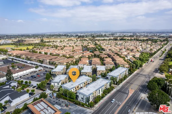 an aerial view of a house with a garden