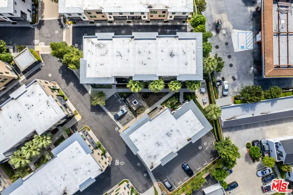 an aerial view of residential building and parking space