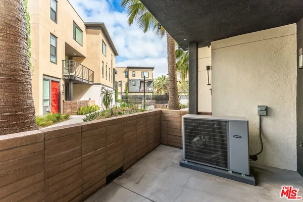 a view of an empty room with glass door