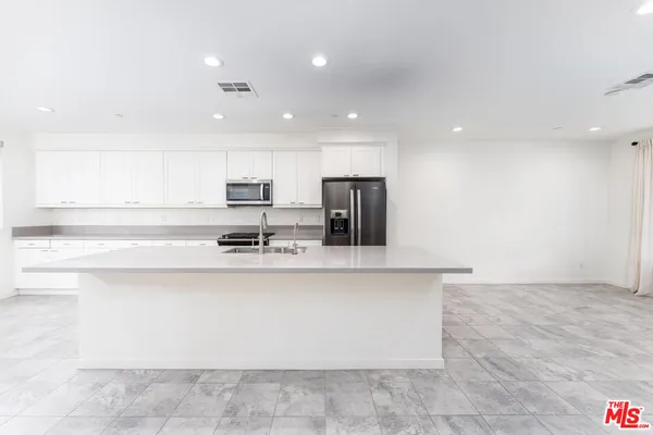a view of a kitchen with a sink