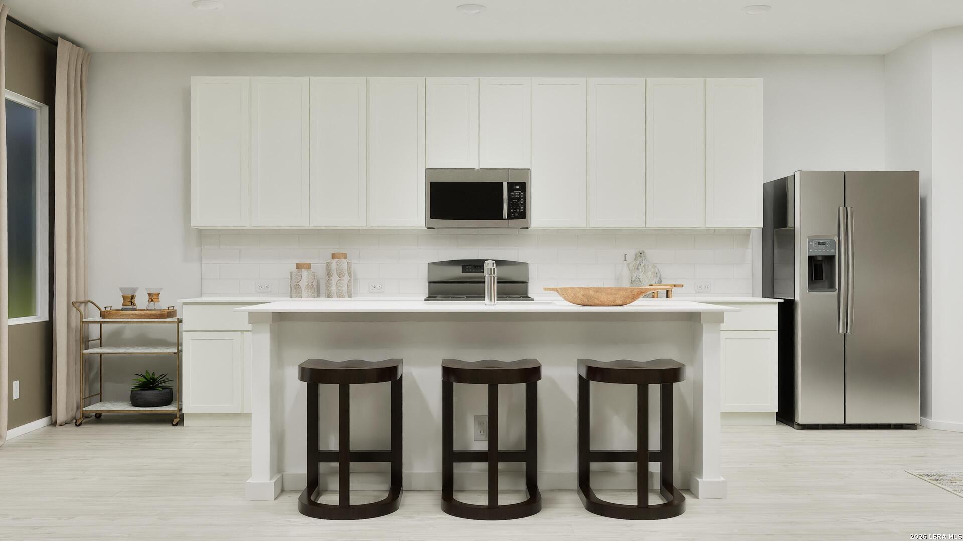 2123 Apollo Drive Portland, TX 78374 - Photo 15 of 32 a kitchen with stainless steel appliances granite countertop a refrigerator and a stove top oven