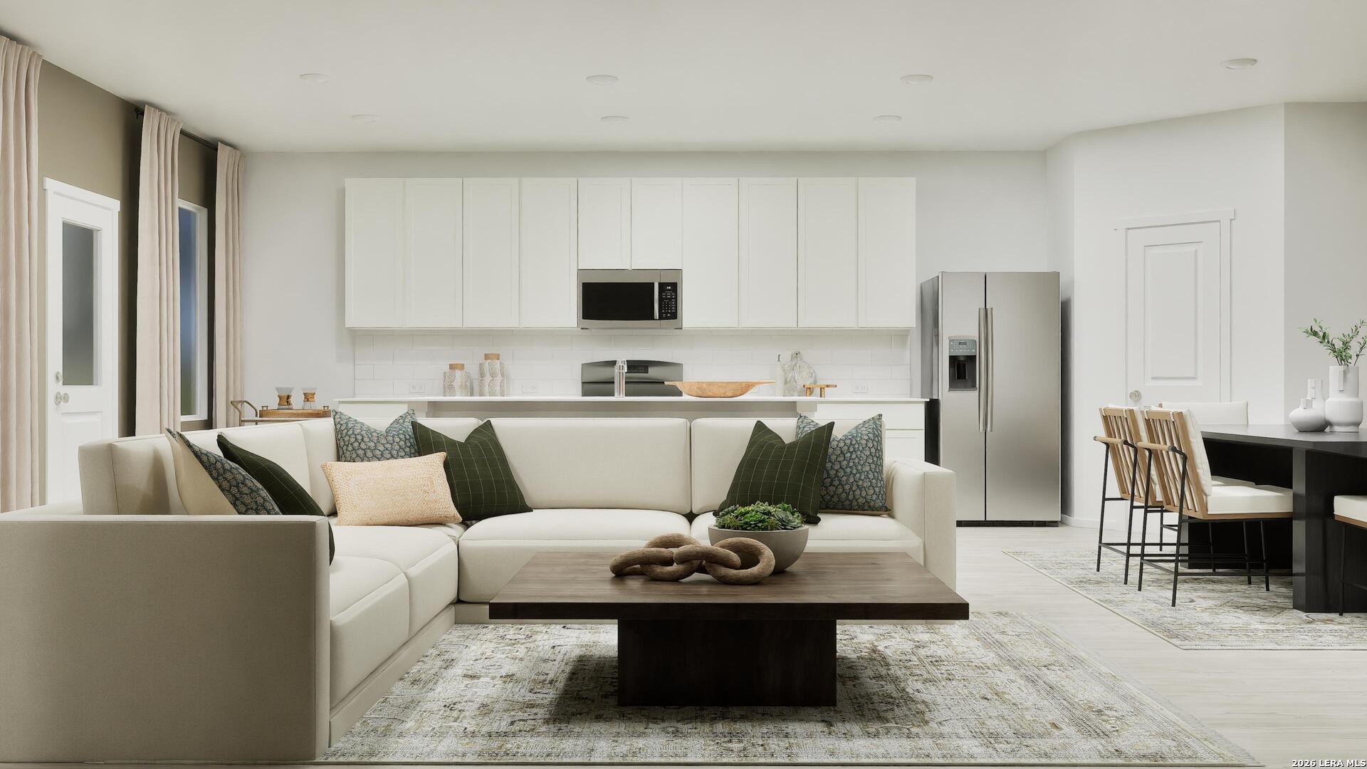 2123 Apollo Drive Portland, TX 78374 - Photo 5 of 32 a living room with furniture and a refrigerator