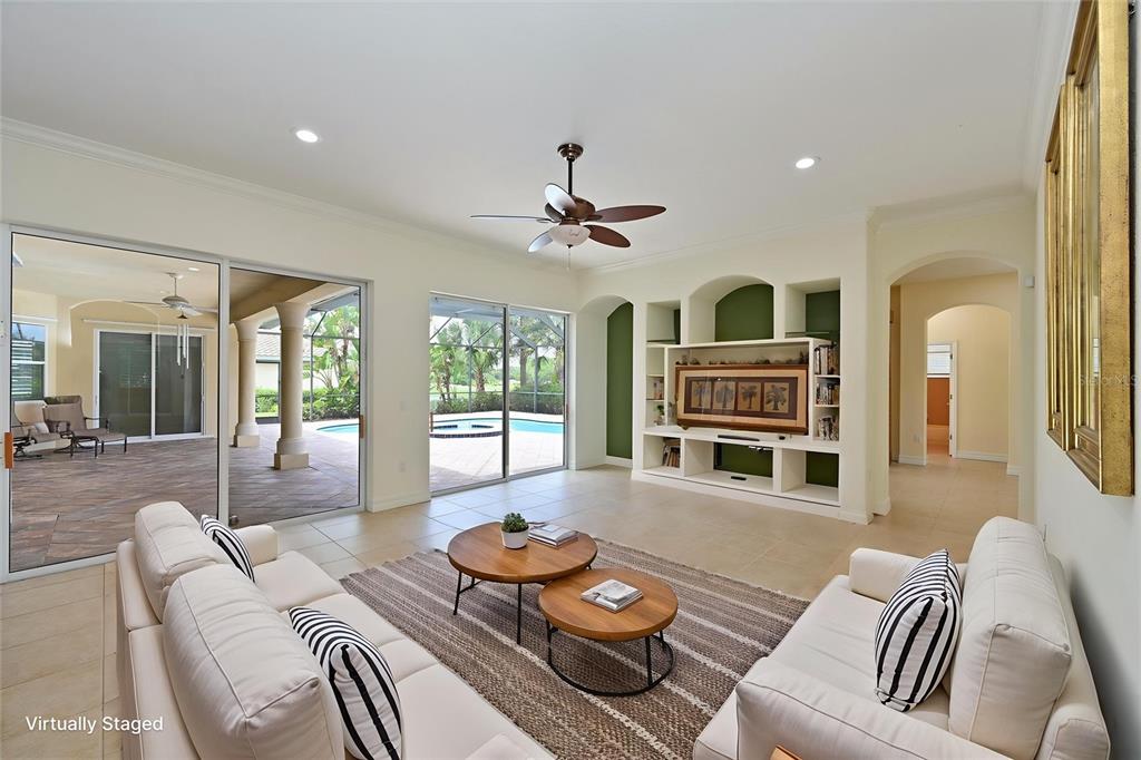 10622 Conch Shell Terrace Bradenton, FL 34212 - Photo 12 of 69 a living room with furniture and a window