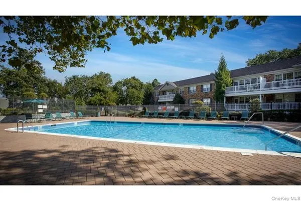 a view of a swimming pool and deck