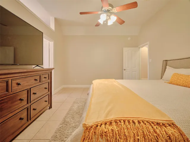 a bedroom with a bed and a dresser