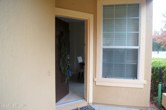 a view of a door and a window