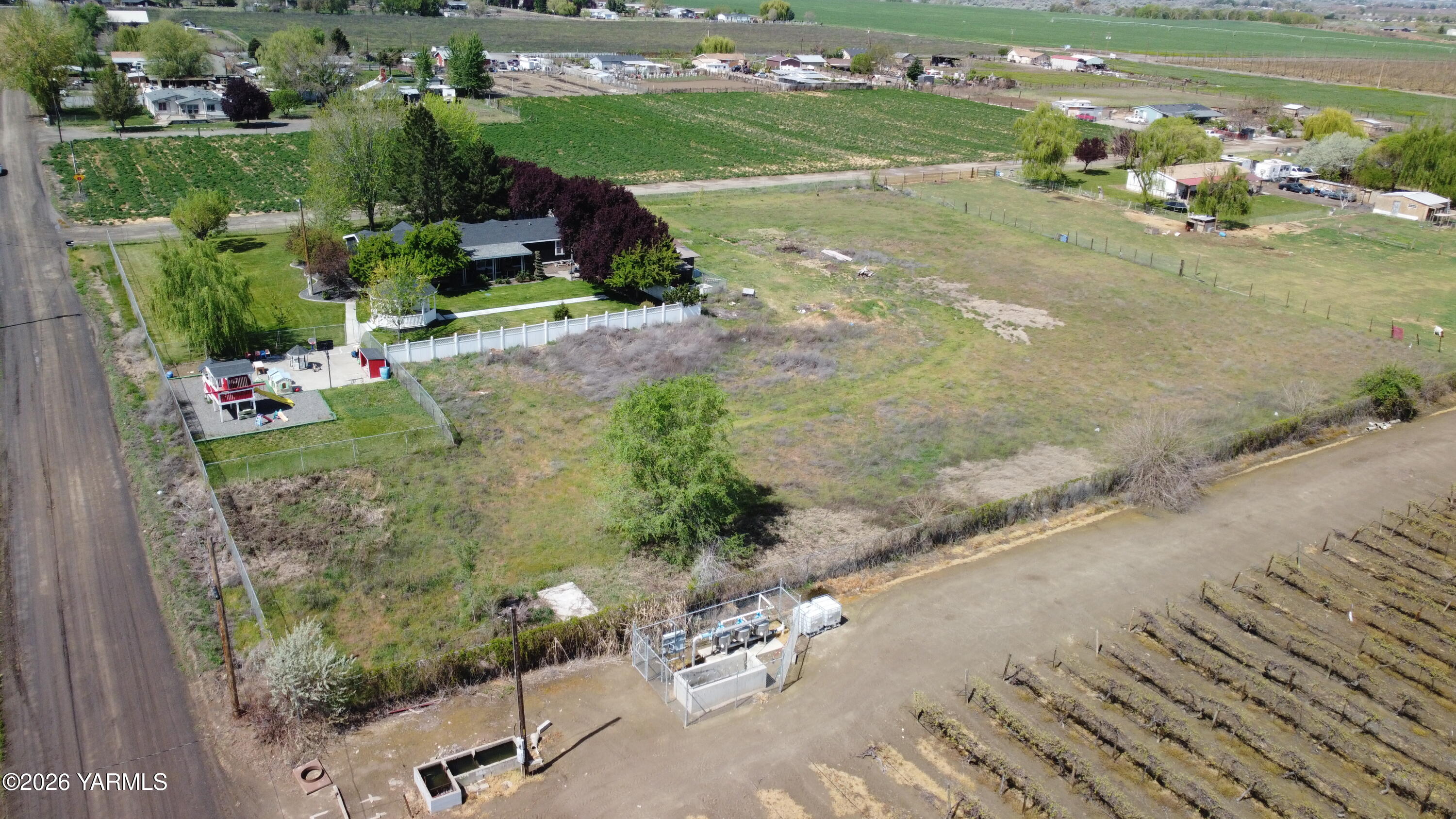 1051 County Line Mabton, WA 98935 - Photo 20 of 22 an aerial view of a house with a yard basket ball court and outdoor seating