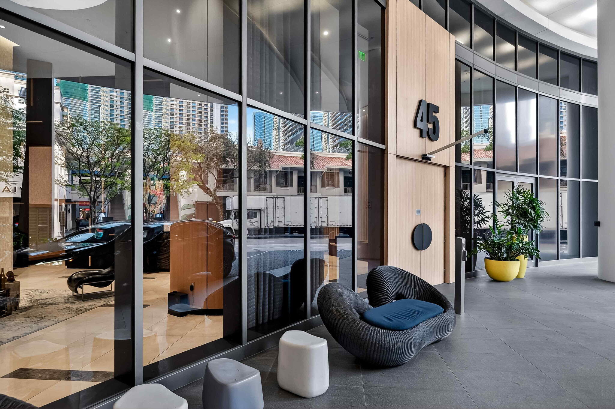 55 Southwest 9th Street, Unit 3704 Miami, FL 33130 - Photo 48 of 53 a living room with furniture and a potted plant