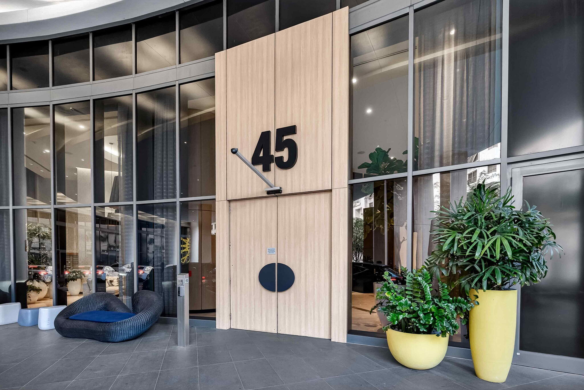55 Southwest 9th Street, Unit 3704 Miami, FL 33130 - Photo 49 of 53 a view of a potted plant in front of a glass door
