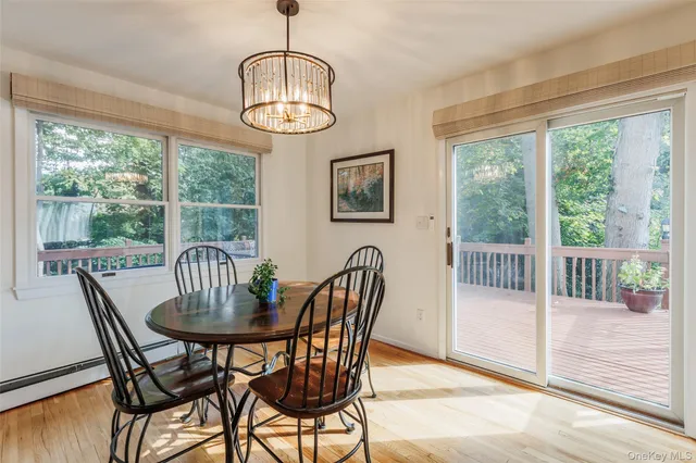 a view of a dining room with furniture window and outside view