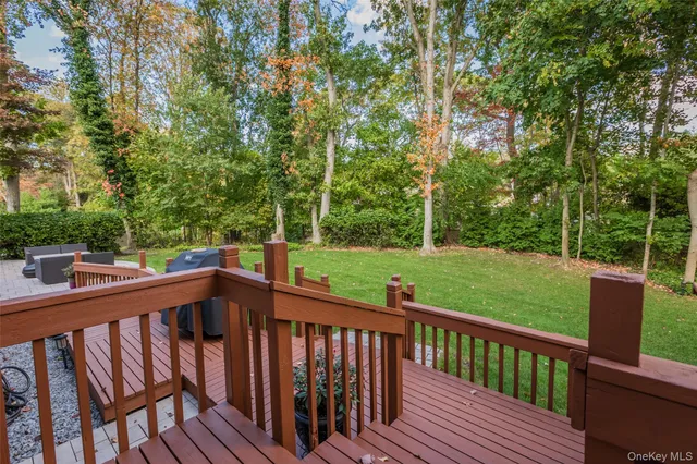 a view of balcony with deck and trees