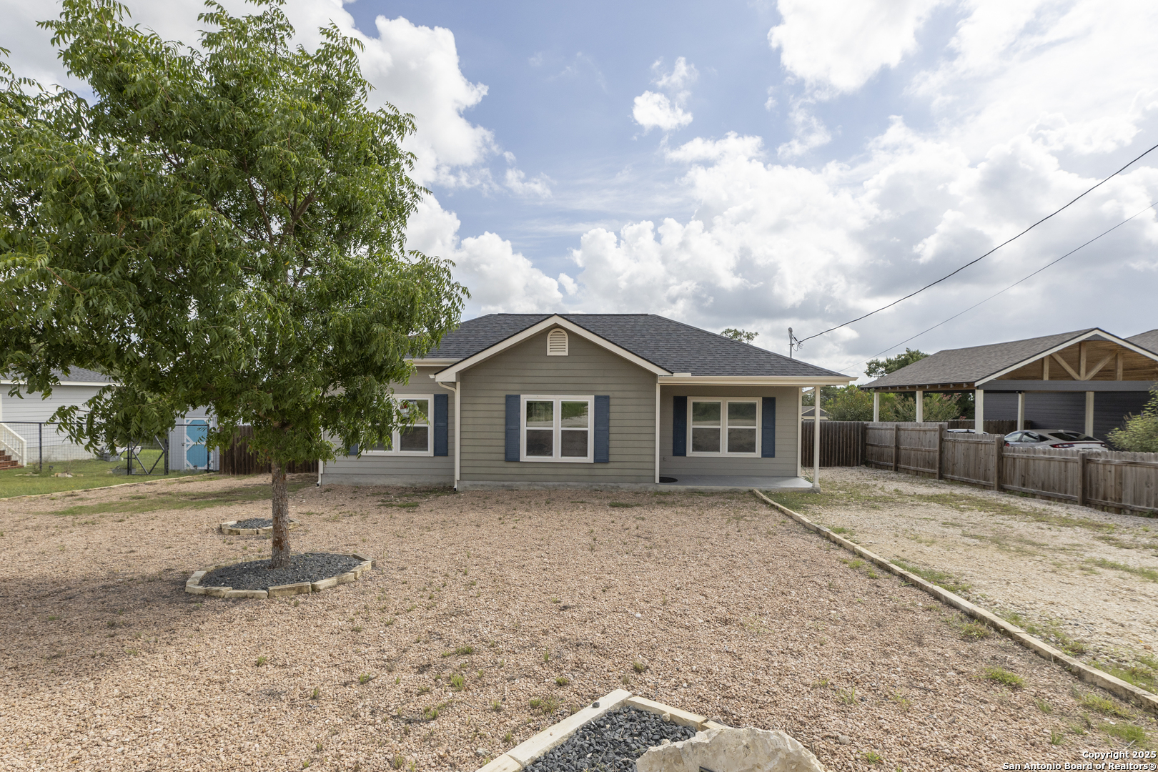 421 Cimarron Spring Branch, TX 78070 - Photo 2 of 29 a house with trees in the background