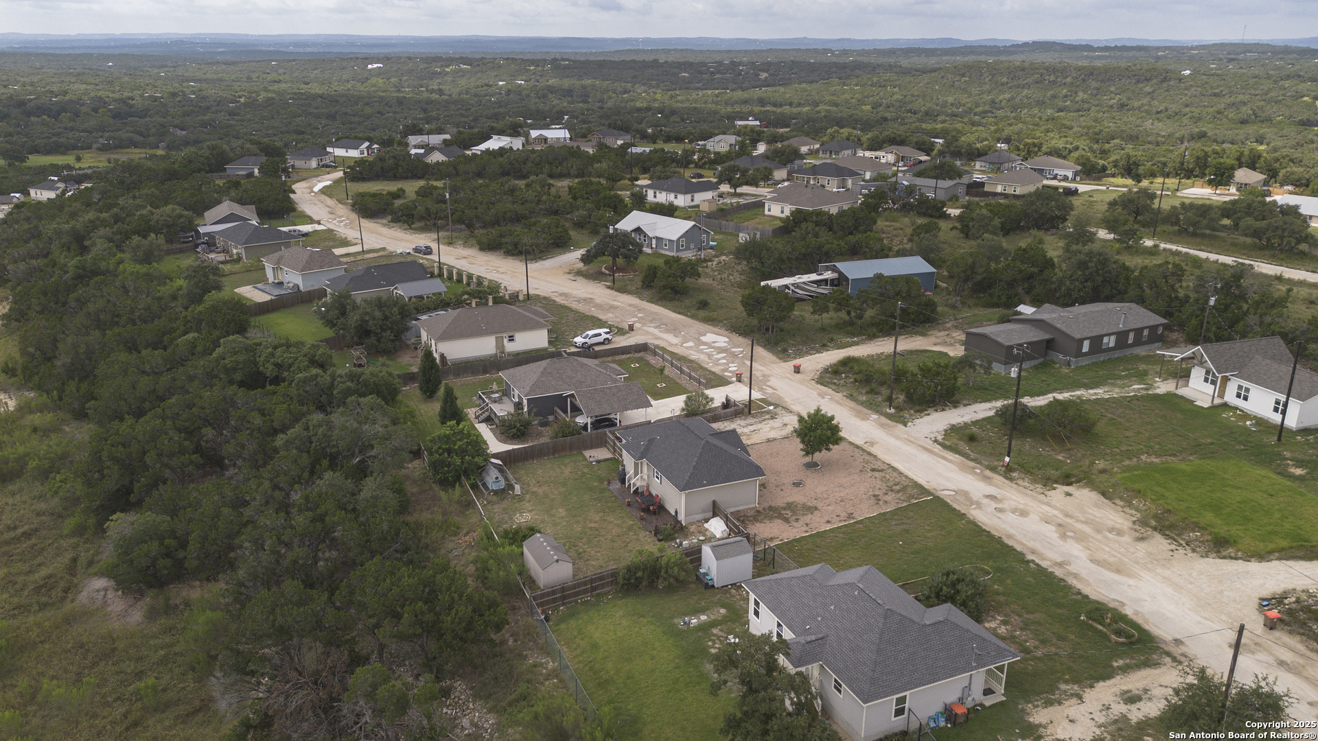 421 Cimarron Spring Branch, TX 78070 - Photo 26 of 29 an aerial view of residential houses with outdoor space and river