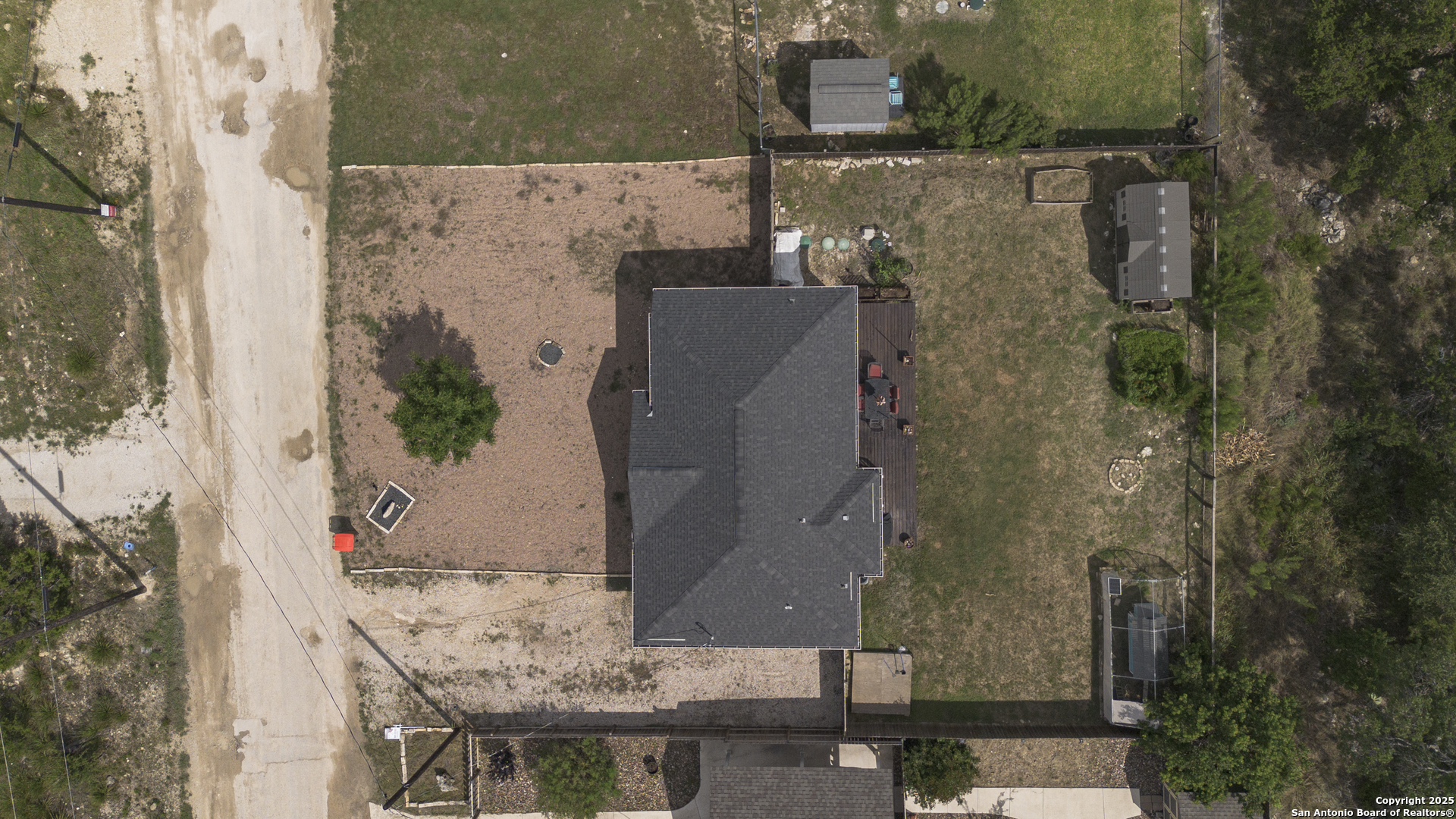 421 Cimarron Spring Branch, TX 78070 - Photo 28 of 29 an aerial view of a house with a yard and large tree