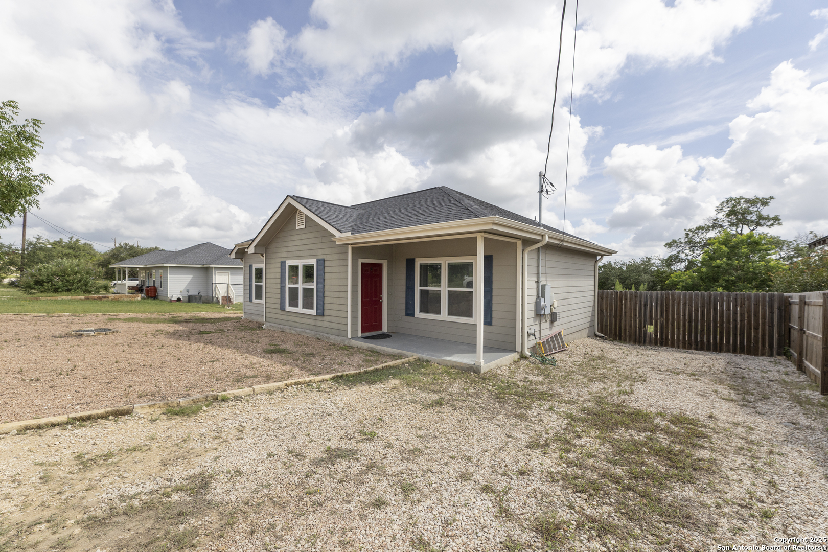 421 Cimarron Spring Branch, TX 78070 - Photo 3 of 29 a front view of a house with a yard and fence