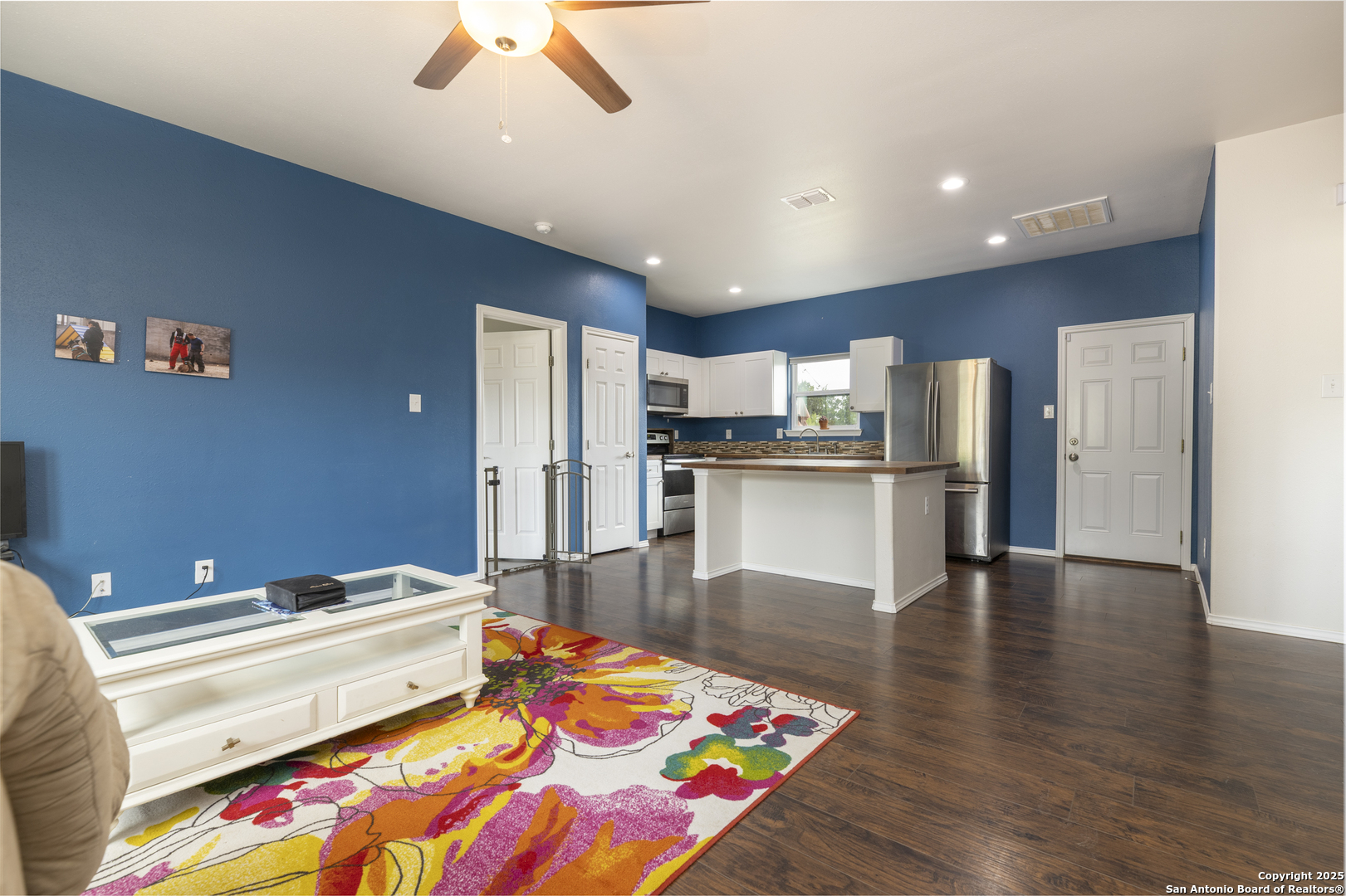 421 Cimarron Spring Branch, TX 78070 - Photo 6 of 29 a kitchen with stainless steel appliances kitchen island granite countertop a refrigerator and a stove top oven