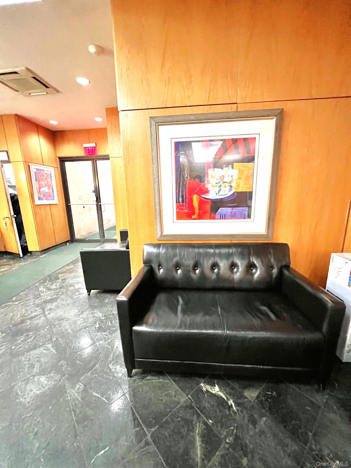 376 Broadway, Unit 11D Manhattan, NY 10013 - Photo 5 of 11 a living room with furniture and a flat screen tv