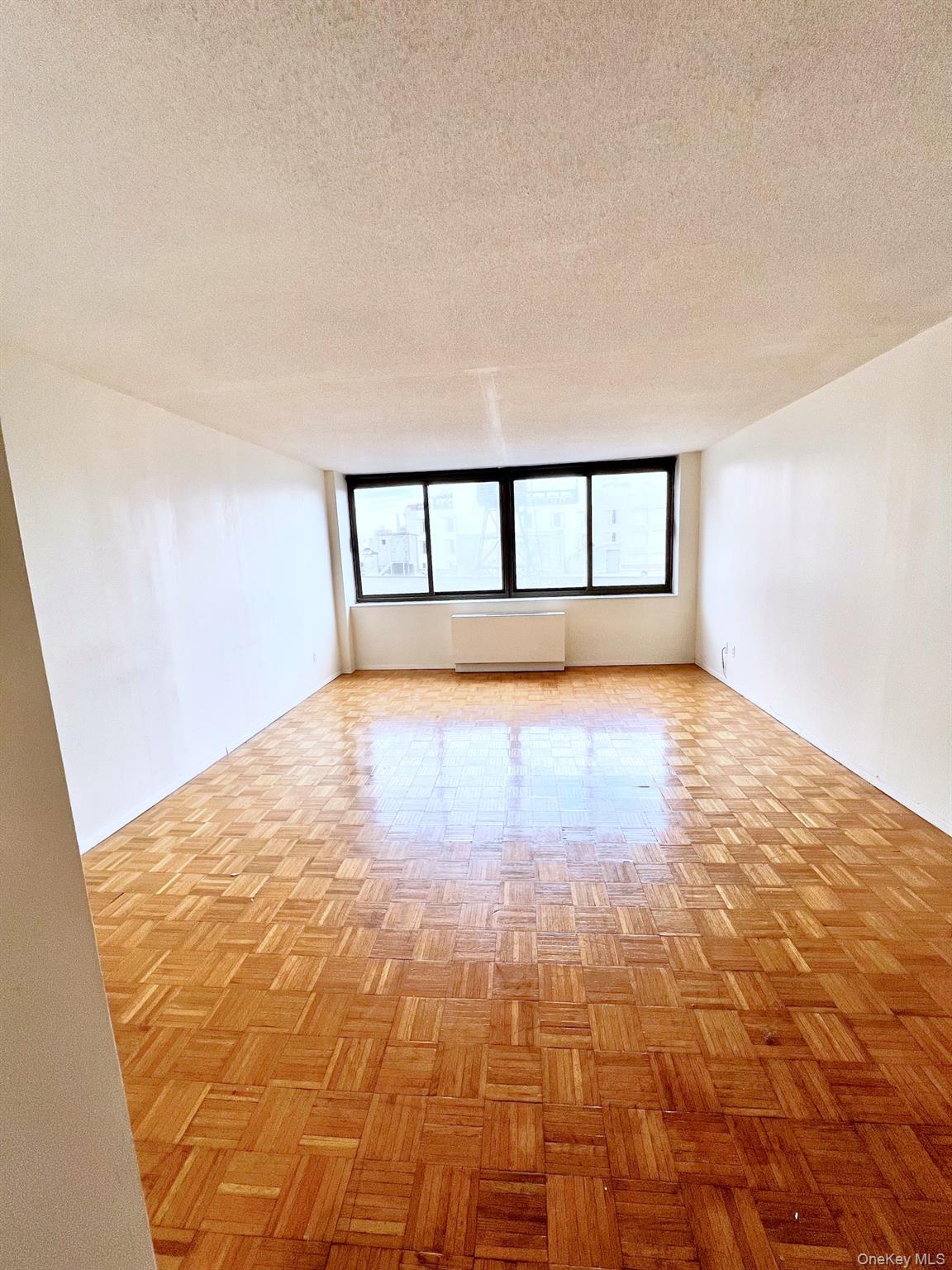 376 Broadway, Unit 11D Manhattan, NY 10013 - Photo 6 of 11 a view of a big room with an empty space