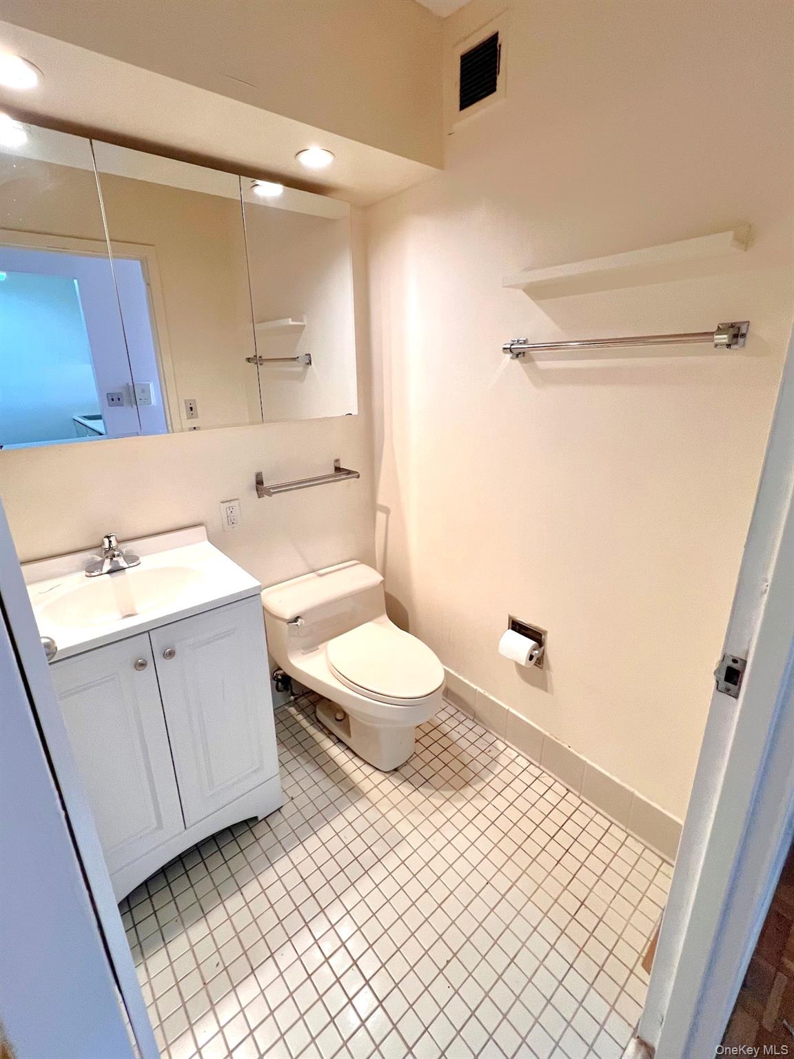 376 Broadway, Unit 11D Manhattan, NY 10013 - Photo 9 of 11 a bathroom with a sink a toilet and shower