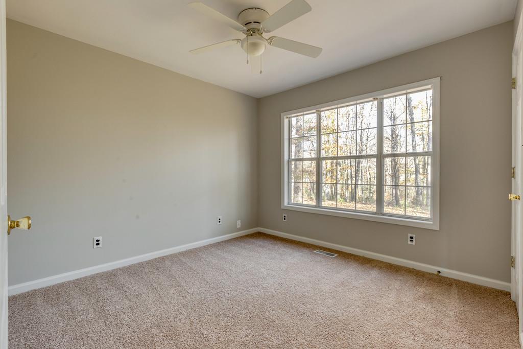 639 Vaughan's Gap Road Spring Hill, TN 37174 - Photo 12 of 19 a view of an empty room with a window