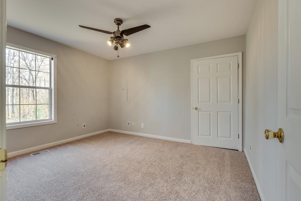639 Vaughan's Gap Road Spring Hill, TN 37174 - Photo 13 of 19 a view of an empty room with a window