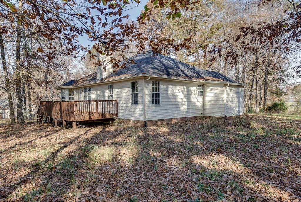 639 Vaughan's Gap Road Spring Hill, TN 37174 - Photo 16 of 19 a view of a house with a yard
