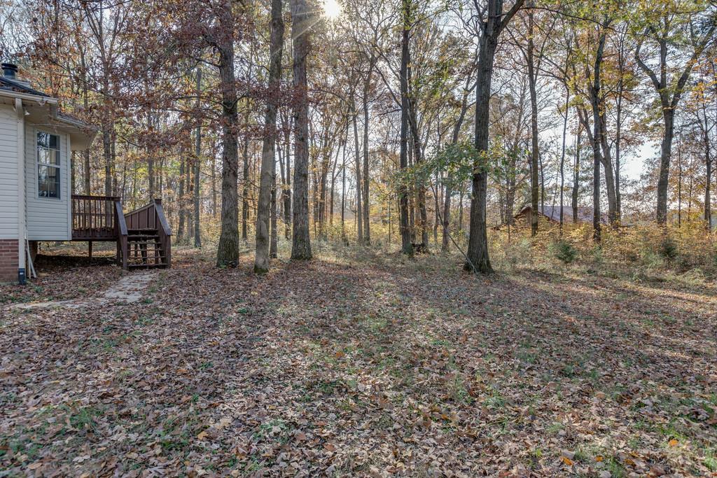 639 Vaughan's Gap Road Spring Hill, TN 37174 - Photo 19 of 19 a view of outdoor space with deck and yard