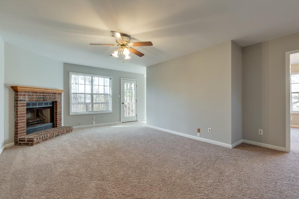 639 Vaughan's Gap Road Spring Hill, TN 37174 - Photo 3 of 19 a view of an empty room with a fireplace and a window