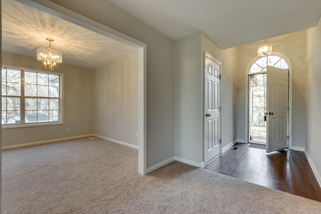 639 Vaughan's Gap Road Spring Hill, TN 37174 - Photo 4 of 19 wooden floor in an empty room with a window