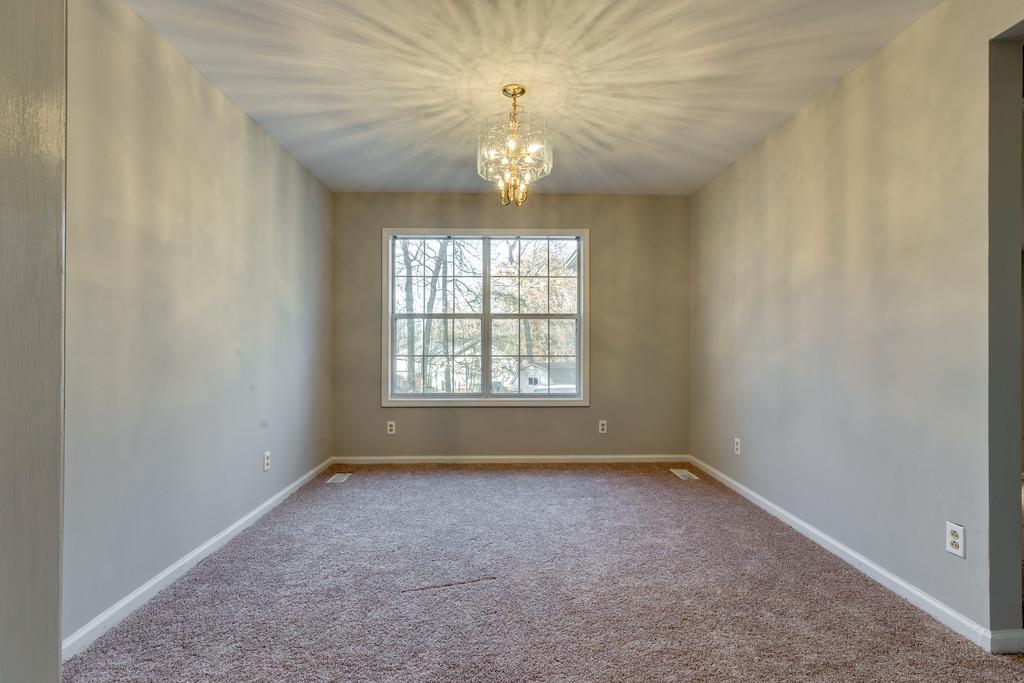 639 Vaughan's Gap Road Spring Hill, TN 37174 - Photo 5 of 19 a view of an empty room with a window