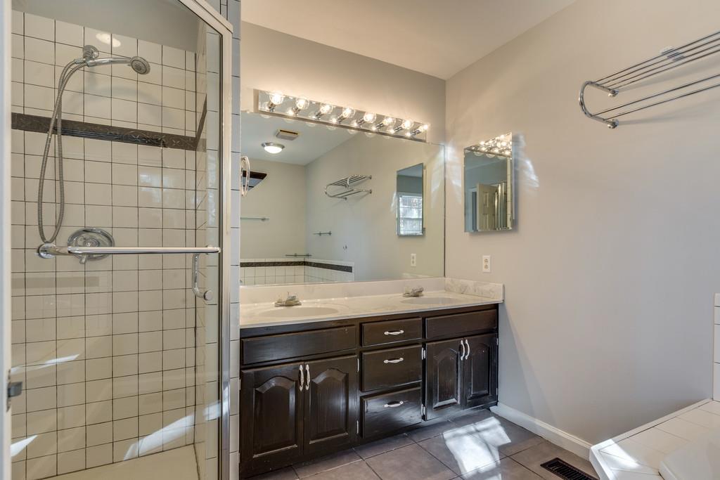 639 Vaughan's Gap Road Spring Hill, TN 37174 - Photo 10 of 19 a bathroom with a double vanity sink mirror and double