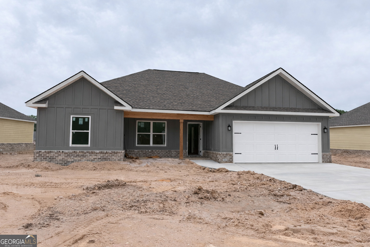 515 New Hope Drive Perry, GA 31069 - Photo 1 of 1 a front view of a house with a yard and garage