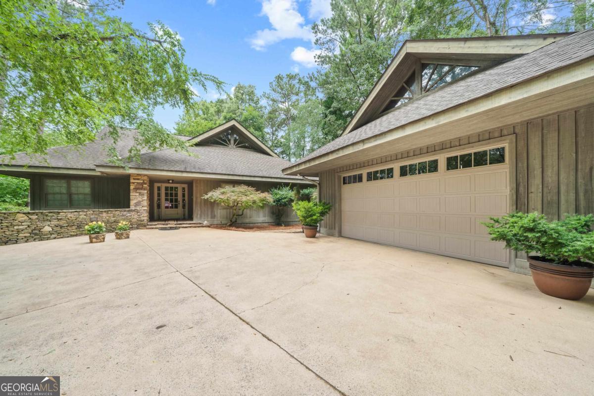 1031 Old Still Road Greensboro, GA 30642 - Photo 12 of 73 a view of a house with backyard and sitting area