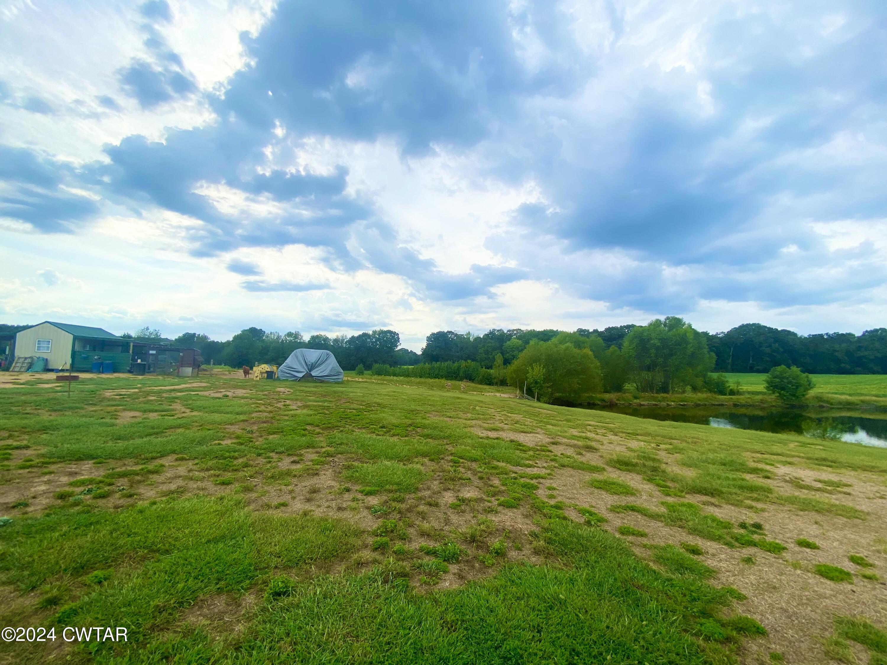 4474 Flatwoods Road Camden, TN 38320 - Photo 14 of 18 a view of an ocean from a yard