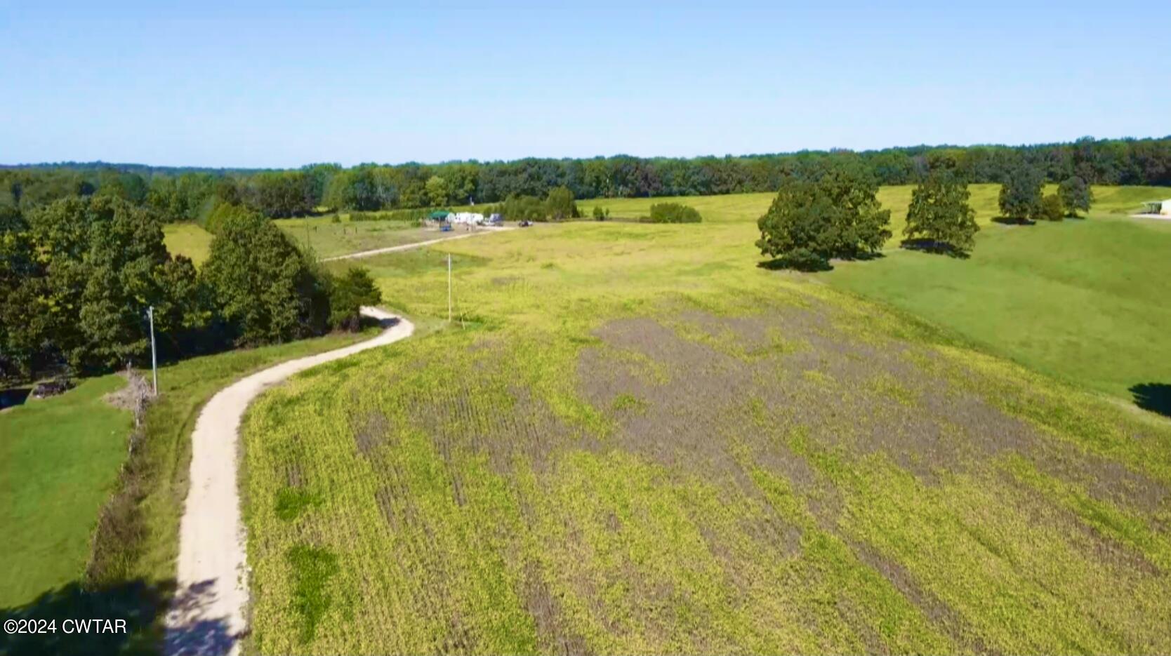 4474 Flatwoods Road Camden, TN 38320 - Photo 2 of 18 a view of a lake view with a large mountain view